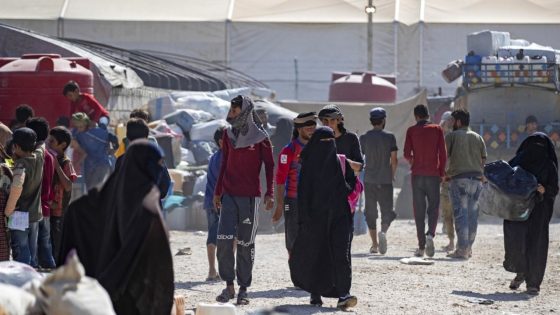 Syrians prepare to be released from the Kurdish-run al-Hol camp, which holds relatives of suspected Islamic State (IS) group fighters, in the northeastern Hasakeh governorate on August 14, 2022. (Photo by Delil SOULEIMAN / AFP)