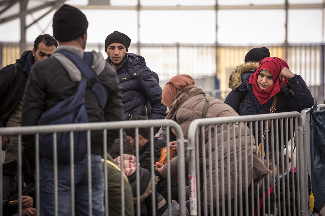 SPIELFELD, AUSTRIA-- Asylum-seekers from Syria and Iraq wait to be bused from the Austrian registration center on February 20, 2016, after crossing the border from Slovenia. Austria implemented new procedures limiting the number of asylum-seekers allowed each day, creating a domino-effect down the Balkan route and creating backups in Greece and Serbia. (Photo by Jodi Hilton/NurPhoto) (Photo by NurPhoto/NurPhoto via Getty Images)